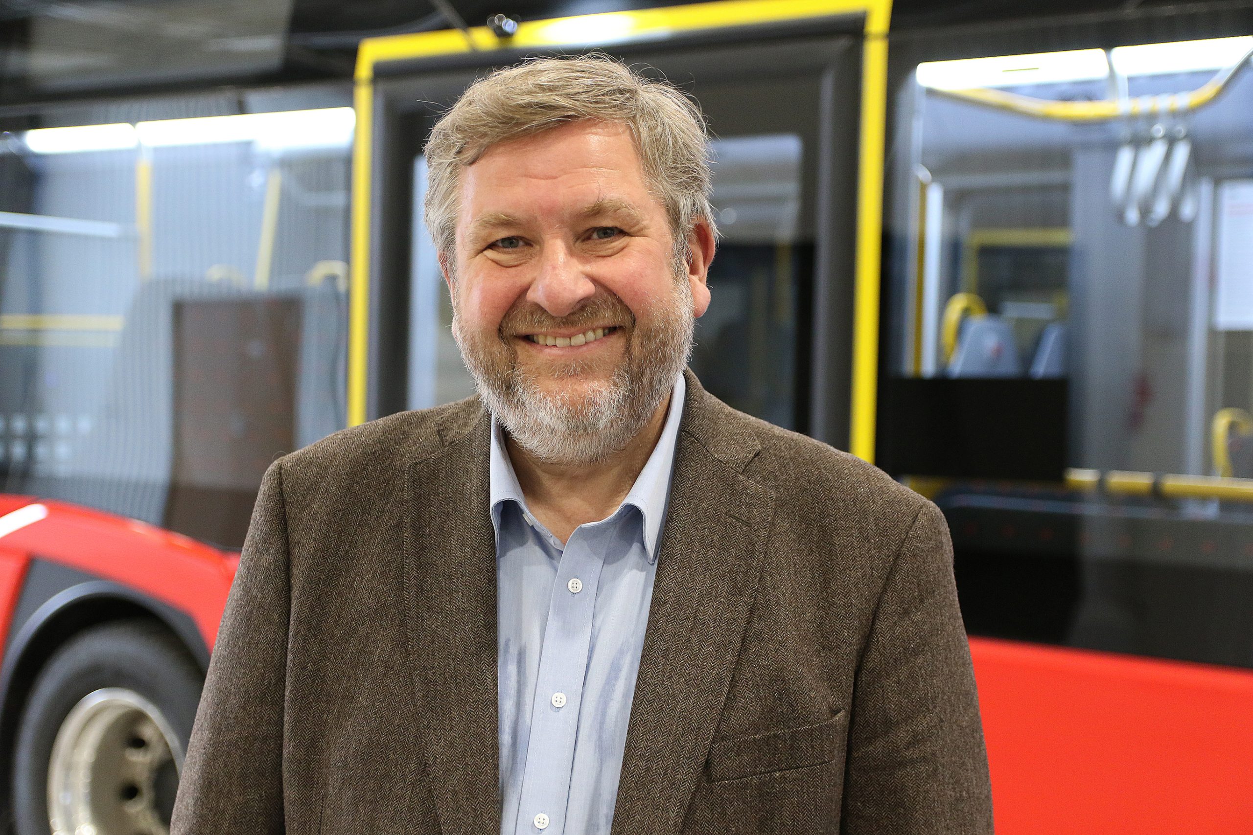 CEO of Ruter As, Bernt Reitan Jenssen in front of a bus.